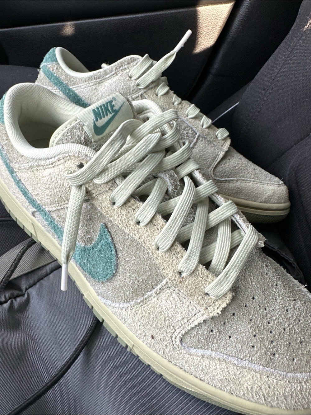 Nike Women’s Low-Top Sneakers in Cream with Teal Swoosh
